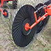 AIC Tillage AICT-RW60LH 60 inch left-hand hay rake wheel installed on an agricultural wheel rake during hay raking