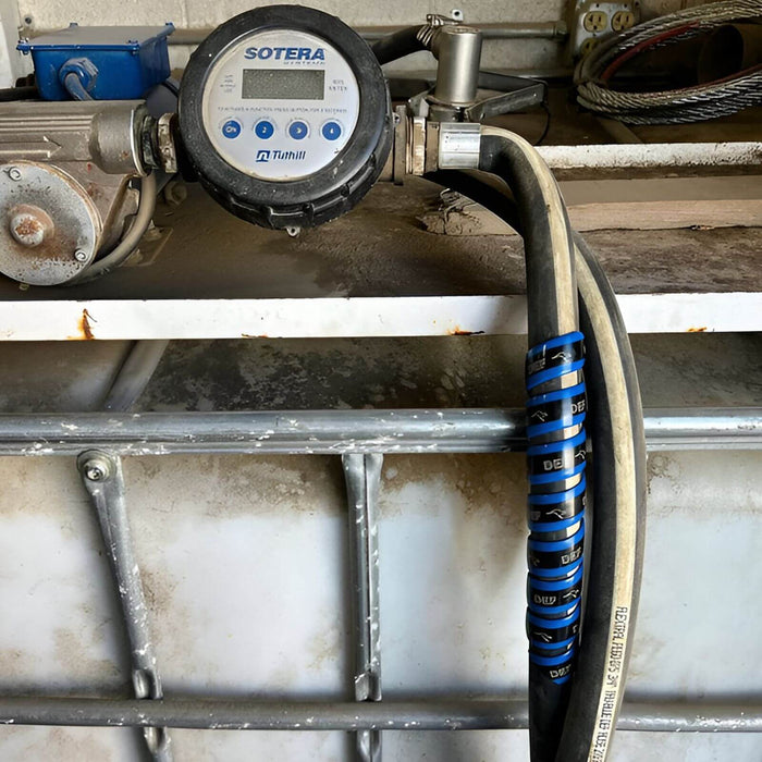 Outback Wrap Fuel Finder blue wrap installed on a DEF fuel hose to clearly identify diesel exhaust fluid lines, Part 20X4GRYB