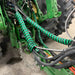 Outback Wrap Hose Boss installed on tractor hydraulic hoses, bundling multiple lines for cleaner routing and easier hookup