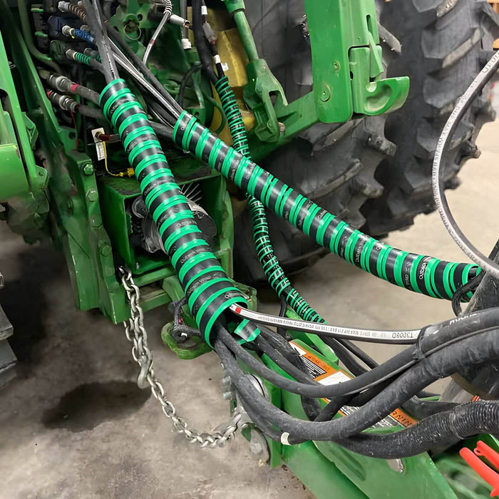 Outback Wrap Hose Boss used on a tractor to bundle and control multiple hydraulic hoses for cleaner routing, part 75XGRNHB