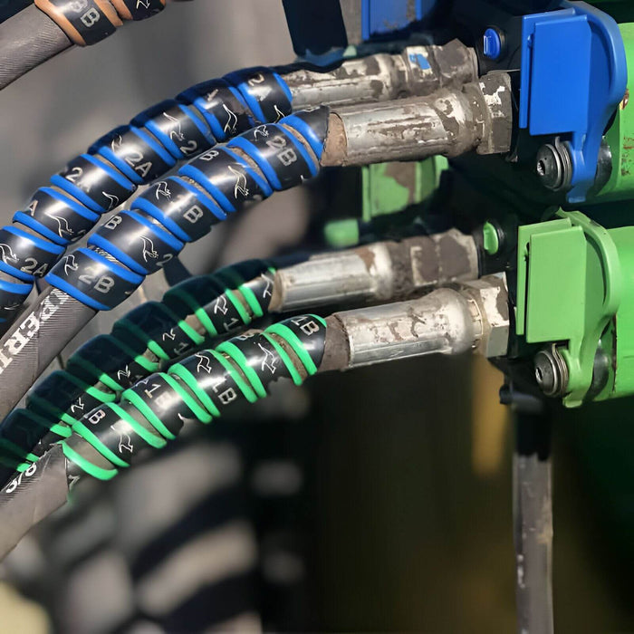 Outback Wraps hydraulic hose color identification wraps in green and blue with A/B markings, Part 18X2G1B2