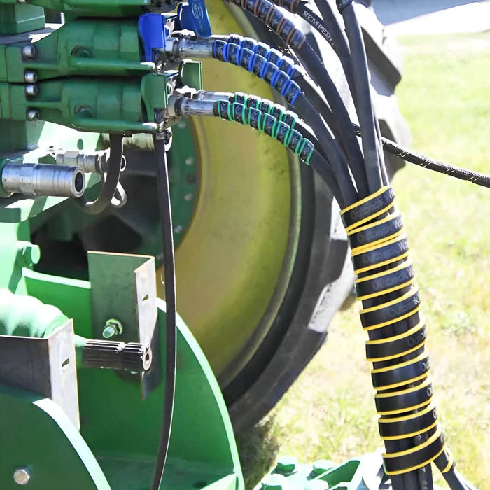 Outback Wraps hydraulic hose wraps installed near hose ends to match green and blue hose-to-port connections, Part 18X2G1B2